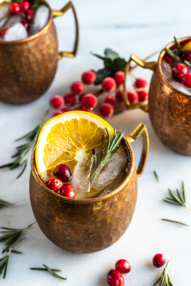 These festive yuletide Cranberry Orange Yule Mules come together with healthier cranberry orange syrup, ginger beer and of course vodka!