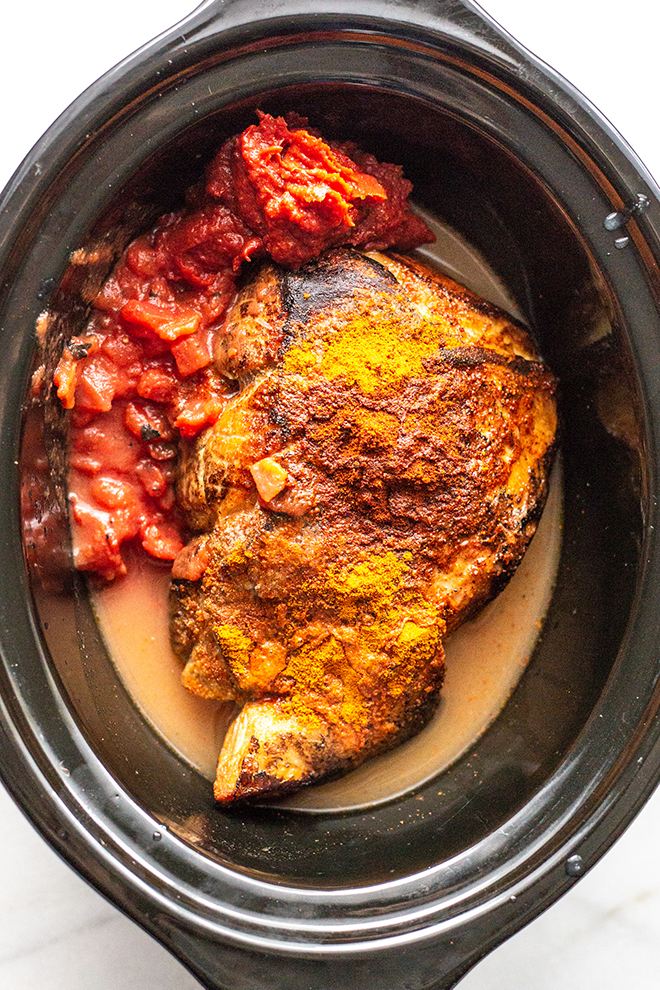 ingredients for pork tacos in a blackslow cooker 