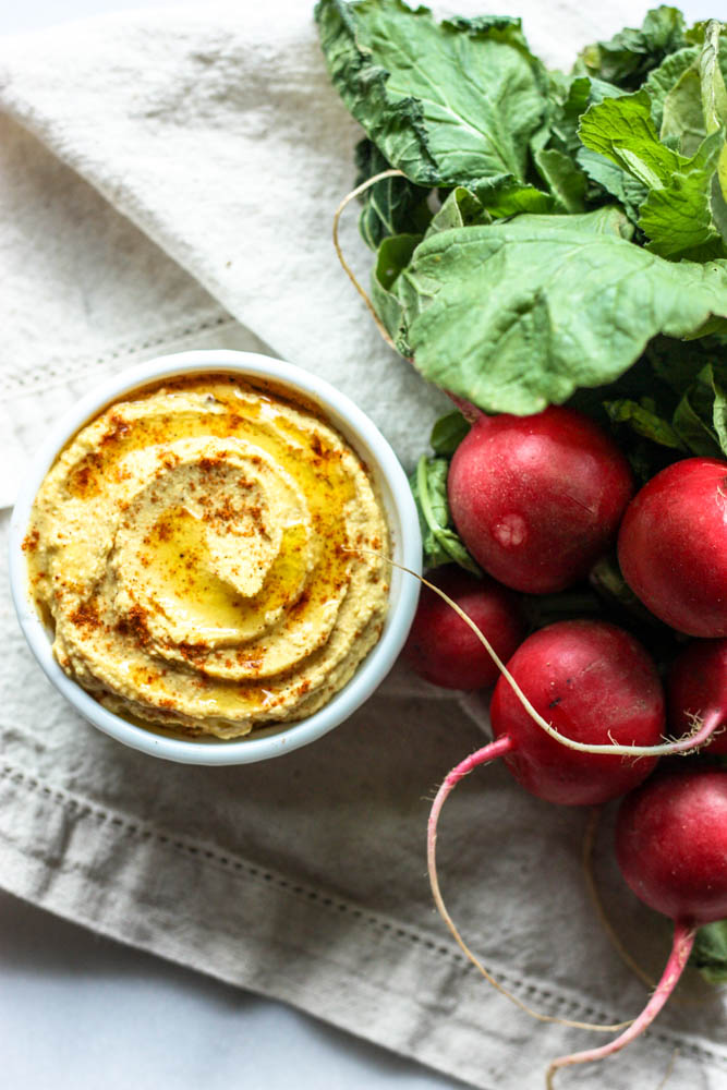 Moroccan Spiced Hummus - Learn how to make this Moroccan Spiced Hummus from scratch. The spices pair perfectly with dreamy, whipped chickpea dip for a great snack. This healthy hummus isn't spicy but it has so much flavor. It's easy but authentic because you make it from dried beans. It's the best way to make hummus. #hummus #snack #glutenfree #dairyfree #healthy #healthyrecipe #howto