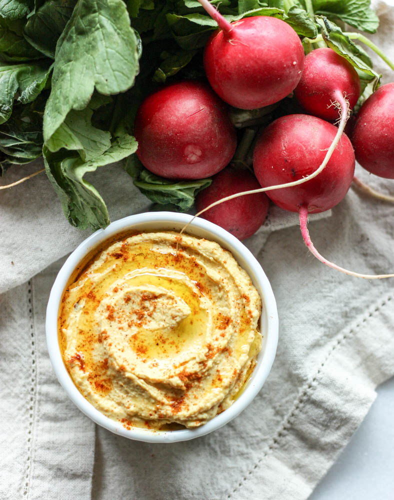 Moroccan Spiced Hummus - Learn how to make this Moroccan Spiced Hummus from scratch. The spices pair perfectly with dreamy, whipped chickpea dip for a great snack. This healthy hummus isn't spicy but it has so much flavor. It's easy but authentic because you make it from dried beans. It's the best way to make hummus. #hummus #snack #glutenfree #dairyfree #healthy #healthyrecipe #howto