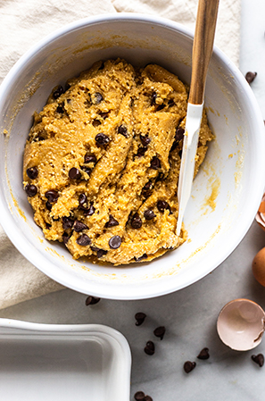 chocolate cookie batter mixing up on a white background