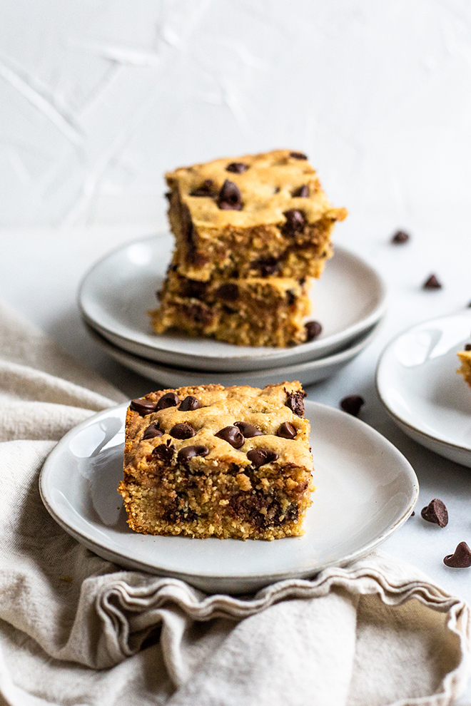 The dairy and grain free Chocolate Chip Cashew Cookie Bars are thick, decadent and gooey. You would never know they have healthy ingredient in them.