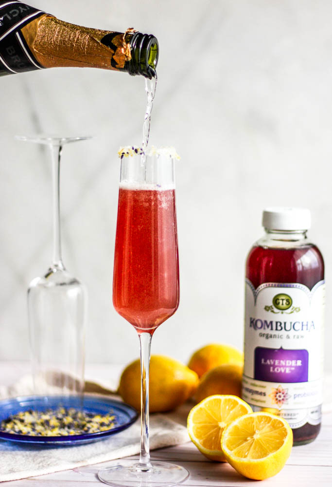 Easy Lavender Lemon Champagne Fizz Cocktails being poured 