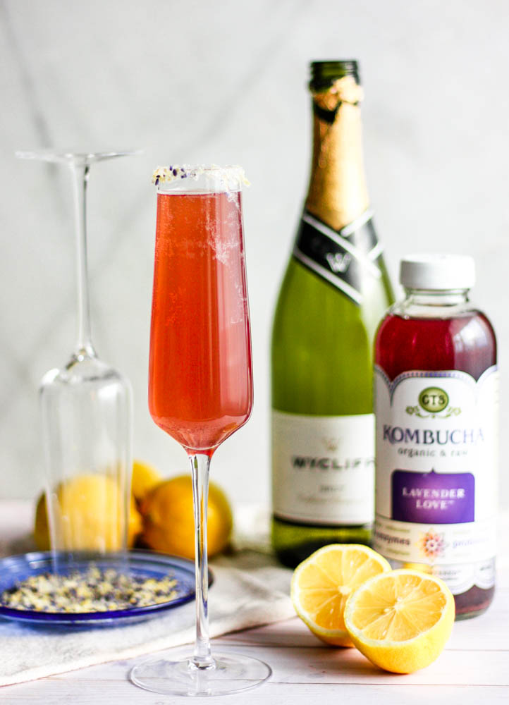 Easy Lavender Lemon Champagne Fizz Cocktails being made on grey marble 