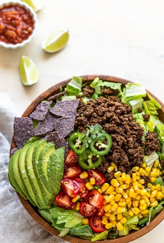 healthy elk taco salad on a white background