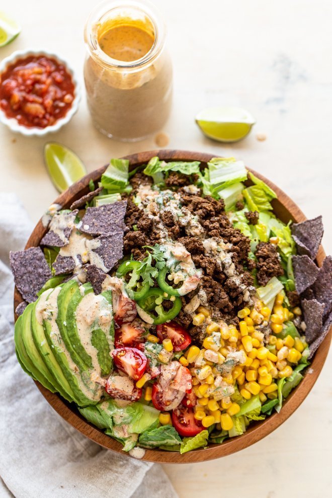 healthy elk taco salad on a white background