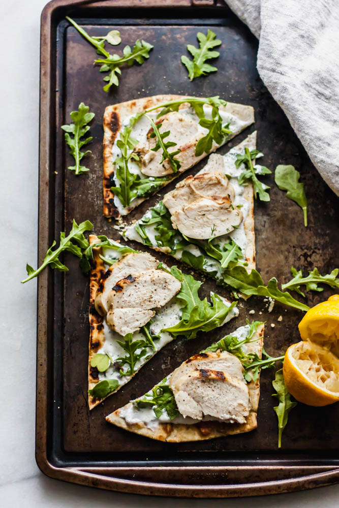 If you need an easy, throw together dinner or starter this juicy lemon chicken on top of grilled flatbread with the most refreshing dill yogurt sauce topped with arugula is just the thing!