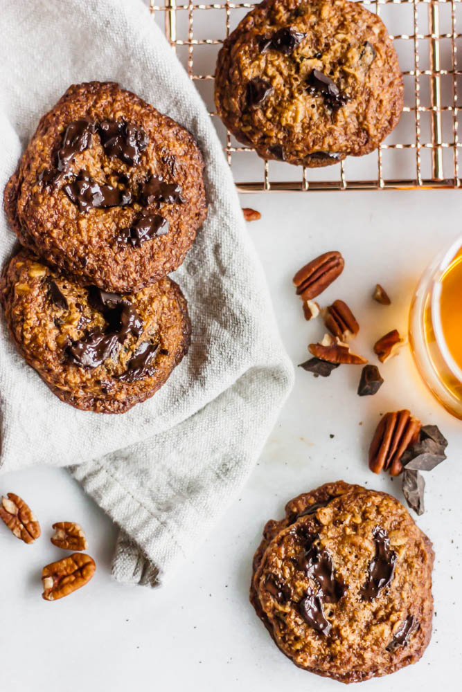 Chewy, gluten-free derby pie oatmeal cookies come together with brown butter, bourbon, and chocolate chunks. 