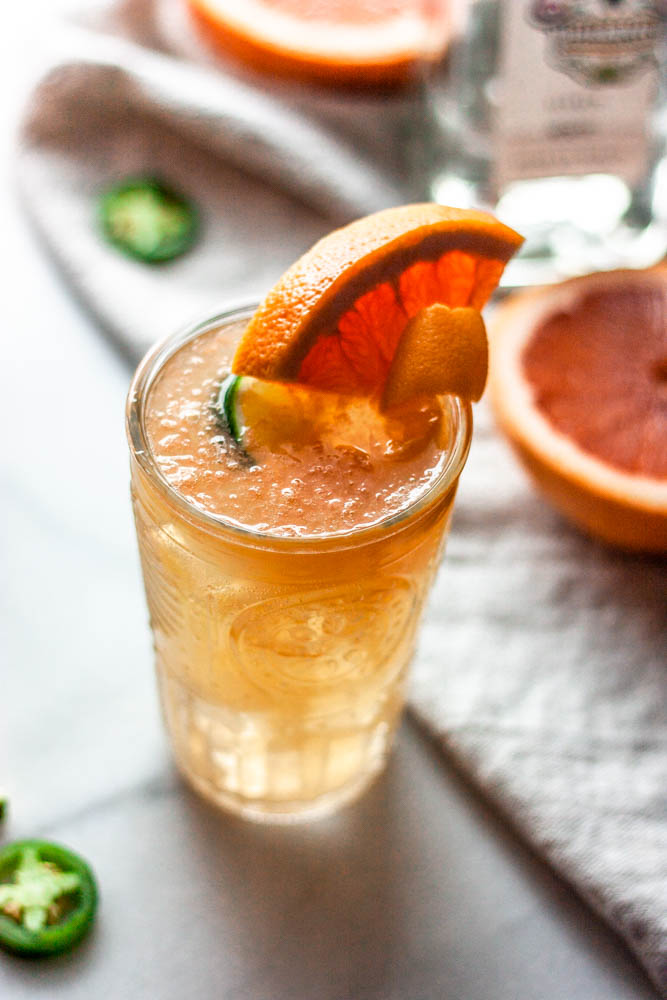 A Spicy Jalapeno Paloma made with fresh grapefruit, jalapenos, agave and of course...tequila. All topped off with grapefruit sparkling water!
