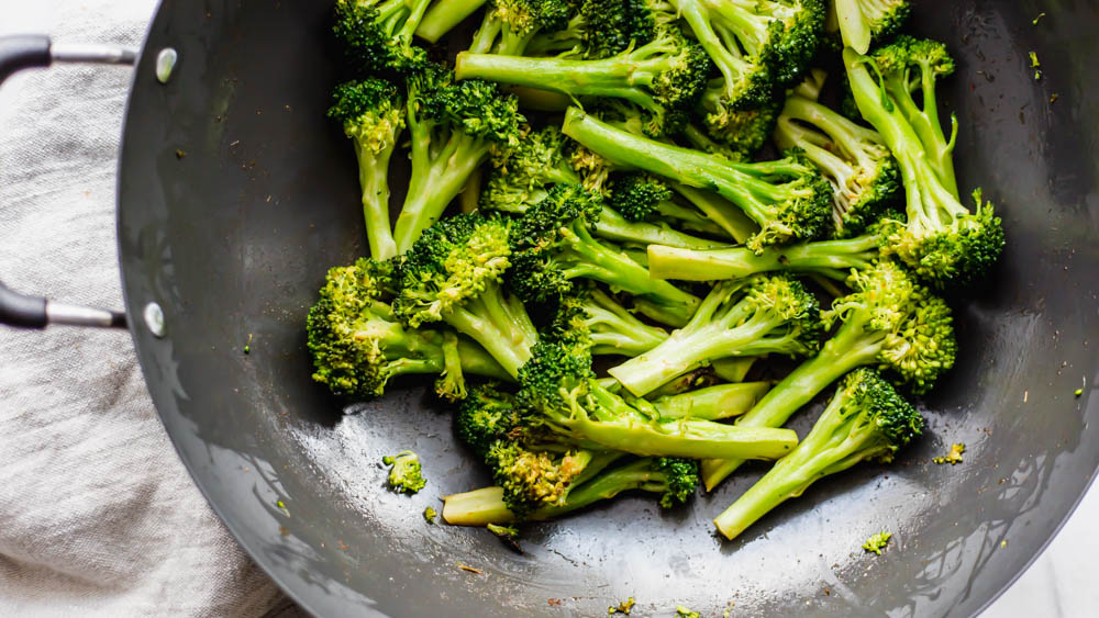 Whole30 Stovetop Spicy Ginger Broccoli- If you need a flavorful side dish all you have to do is saute this Stovetop Spicy Ginger Broccoli on the stove in the delicious, chili ginger sauce. The perfect gluten-free sauce where you can use soy sauce or coconut aminos. This recipe is whole30 compliant and so flavorful! #whole30 #sidedish #paleo #healthy #healthyrecipe #easy #homemade #veggie #broccoli 
