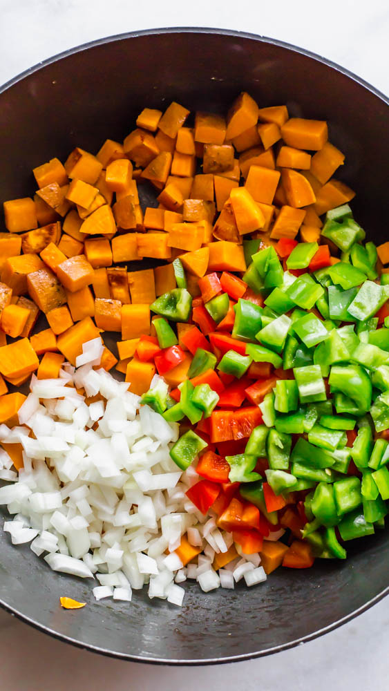 Looking for a better for you hash for breakfast (or whenever)? This Whole30 Bison Sweet Potato Hash has crispy sweet potatoes and veggies, lean bison and the perfect blend of spices. You can top with fried eggs, avocado, and cilantro for the best brunch or breakfast. This lower carb version can be made with turkey, beef, or venison, too. You make it on the stovetop and crisp it in the oven for the perfect potato. This recipe is #whole30approved and #paleo. #healthy #healthyrecipe #paleofood #breakfast 