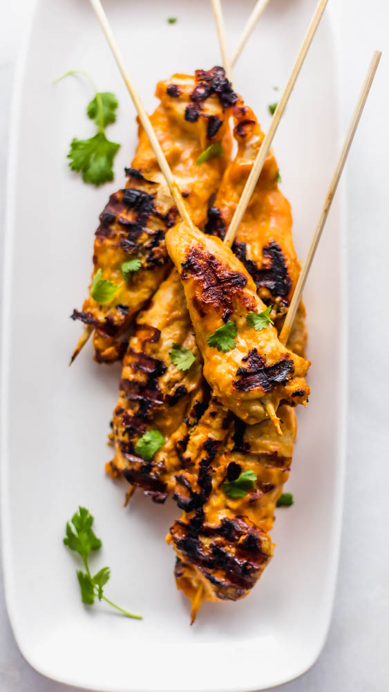 Easy, Thai inspired Whole30 Cashew Chicken Satay Skewers with Chili Cashew Dipping Sauce is the perfect, non-boring recipe you need to make for dinner. This healthy recipe has marinated chicken on skewers and is grilled to perfection. Served with a slightly spicy cashew dipping sauce it is so authentic and peanut free. Paleo and Whole30 Compliant #whole30 #paleo #dairyfree #glutenfree #dinner #healthy #healthyrecipe #recipe #dinnerrecipe #paleorecipe #whole30recipe 