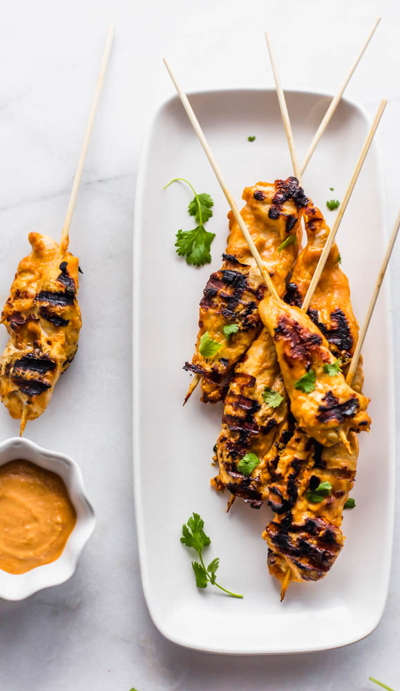 Easy, Thai inspired Whole30 Cashew Chicken Satay Skewers with Chili Cashew Dipping Sauce is the perfect, non-boring recipe you need to make for dinner. This healthy recipe has marinated chicken on skewers and is grilled to perfection. Served with a slightly spicy cashew dipping sauce it is so authentic and peanut free. Paleo and Whole30 Compliant #whole30 #paleo #dairyfree #glutenfree #dinner #healthy #healthyrecipe #recipe #dinnerrecipe #paleorecipe #whole30recipe 