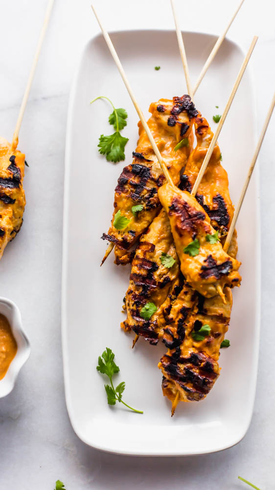 Easy, Thai inspired Whole30 Cashew Chicken Satay Skewers with Chili Cashew Dipping Sauce is the perfect, non-boring recipe you need to make for dinner. This healthy recipe has marinated chicken on skewers and is grilled to perfection. Served with a slightly spicy cashew dipping sauce it is so authentic and peanut free. Paleo and Whole30 Compliant #whole30 #paleo #dairyfree #glutenfree #dinner #healthy #healthyrecipe #recipe #dinnerrecipe #paleorecipe #whole30recipe 