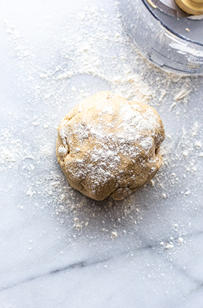 pie crust into a disc on a cutting board