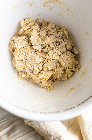 biscuit dough pulled together in a white bowl