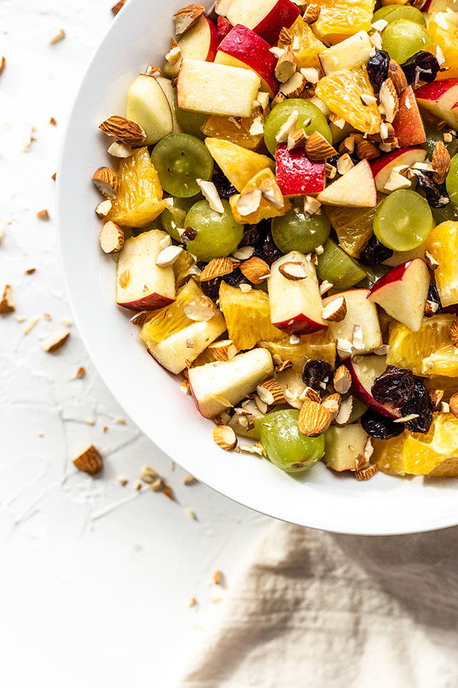 fruit salad with pecans on a white background 