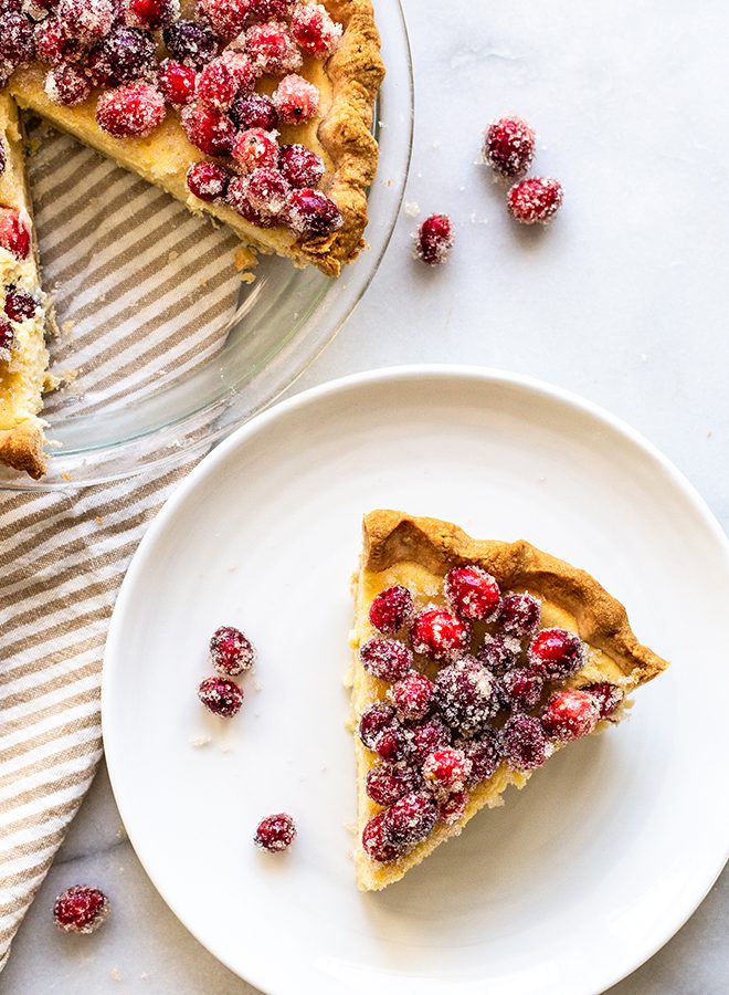 Delicious Buttermilk Cheesecake Pie bakes up like a rich cheesecake in pie crust with Sugared Cranberries to top it off with tartness and festivity.