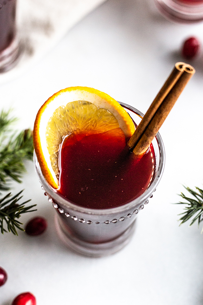 cups of mulled with with cinnamon on a white background 