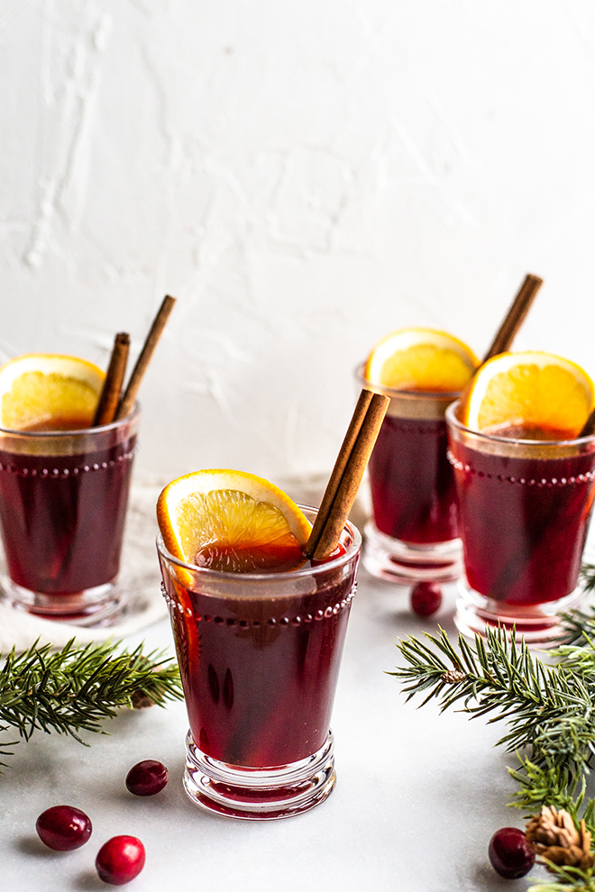 This 5 Ingredient Mulled Wine recipe will warm your heart and knock your socks off it's so good. 5 simple ingredients come together on the stove or in a crockpot for a cup of cheer.