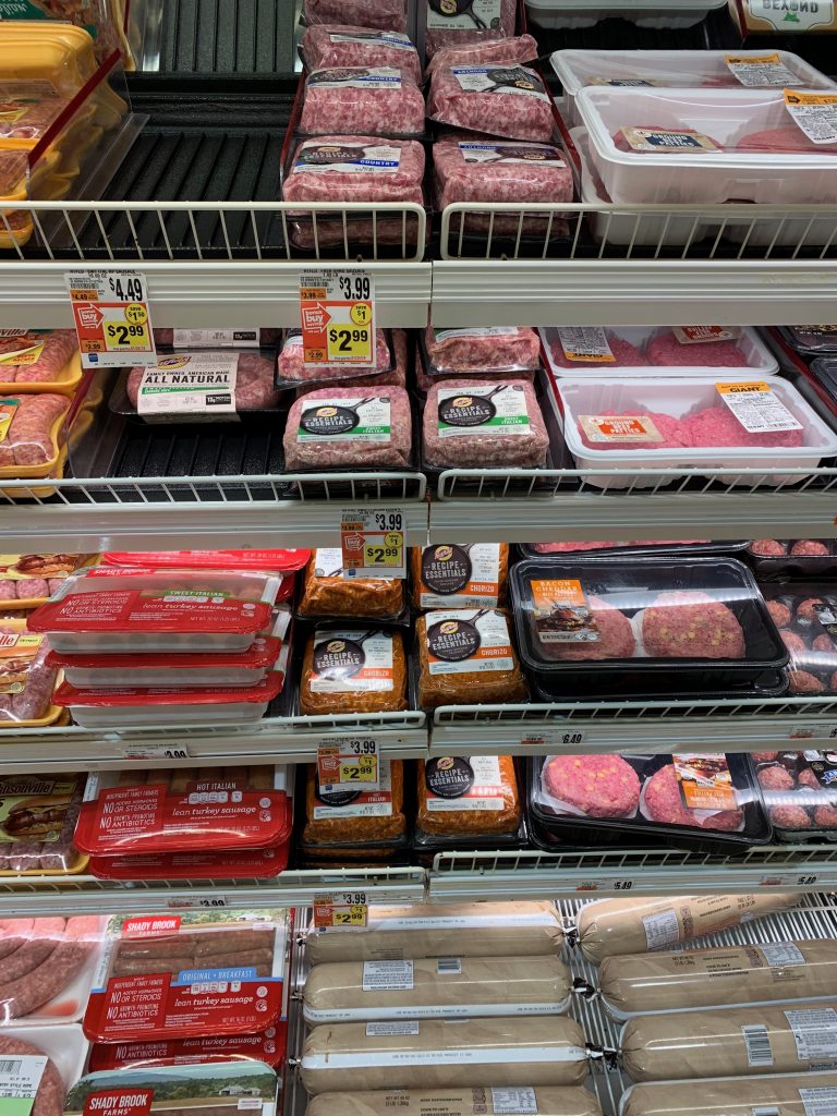 grocery store aisle with pork products 