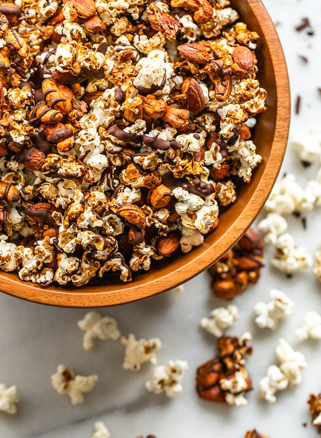 This Healthy Moose Munch snack mix is a salty and sweet treat. Dairy-free coconut caramel and a chocolate drizzle cover crunchy popcorn, almonds, and cashews.