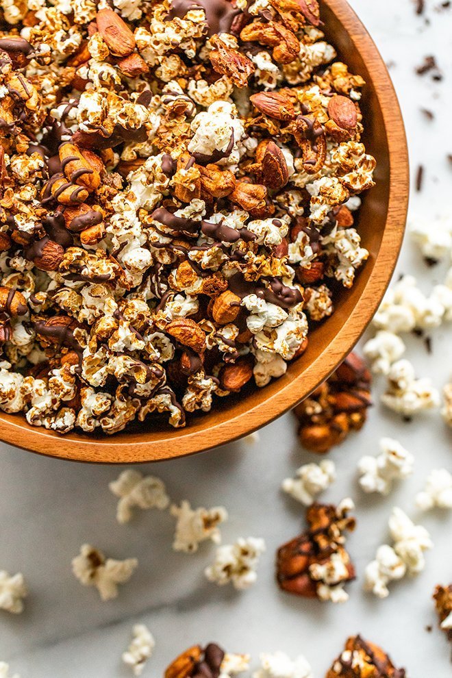 This Healthy Moose Munch snack mix is a salty and sweet treat. Dairy-free coconut caramel and a chocolate drizzle cover crunchy popcorn, almonds, and cashews.