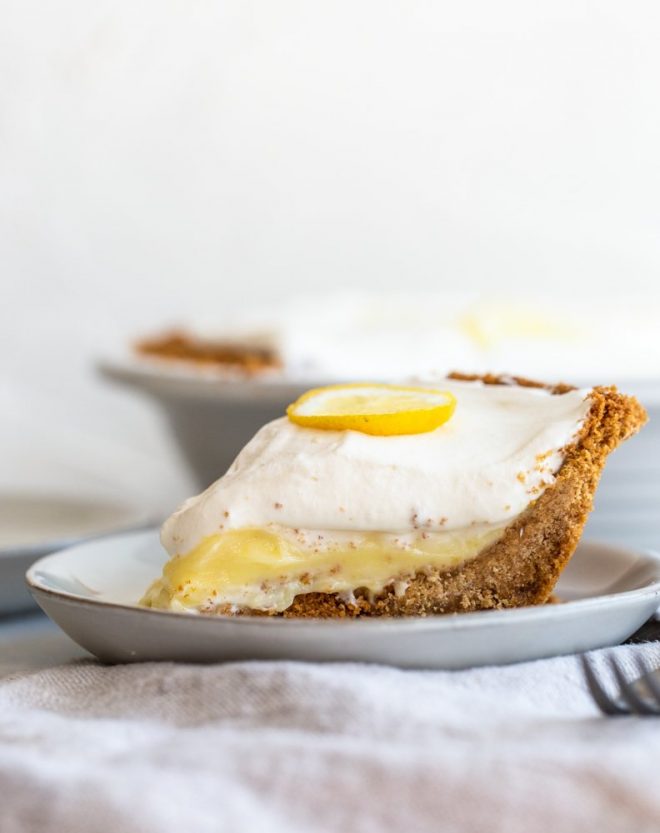 Crunchy and buttery graham cracker crust is filled with tart lemon filling and topped with fresh, lemon cream. A perfect, refreshing dessert.