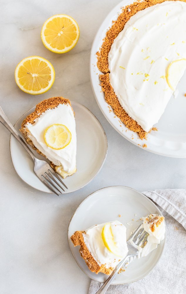 Crunchy and buttery graham cracker crust is filled with tart lemon filling and topped with fresh, lemon cream. A perfect, refreshing dessert.