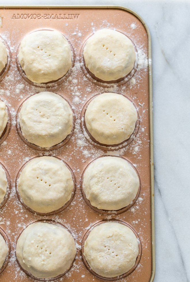 rounds of pie crust shaped over the bottom of a muffin tin to make mini crusts