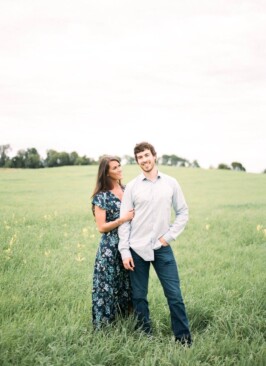 husband and wife in a green field