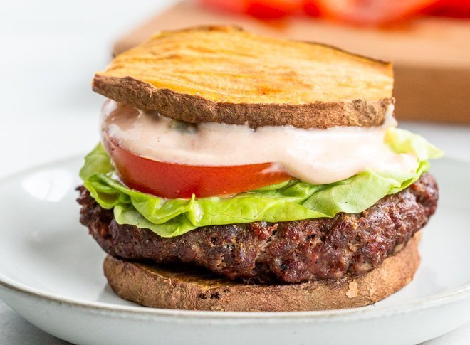 a venison burger with whole30 special sauce on a white plate