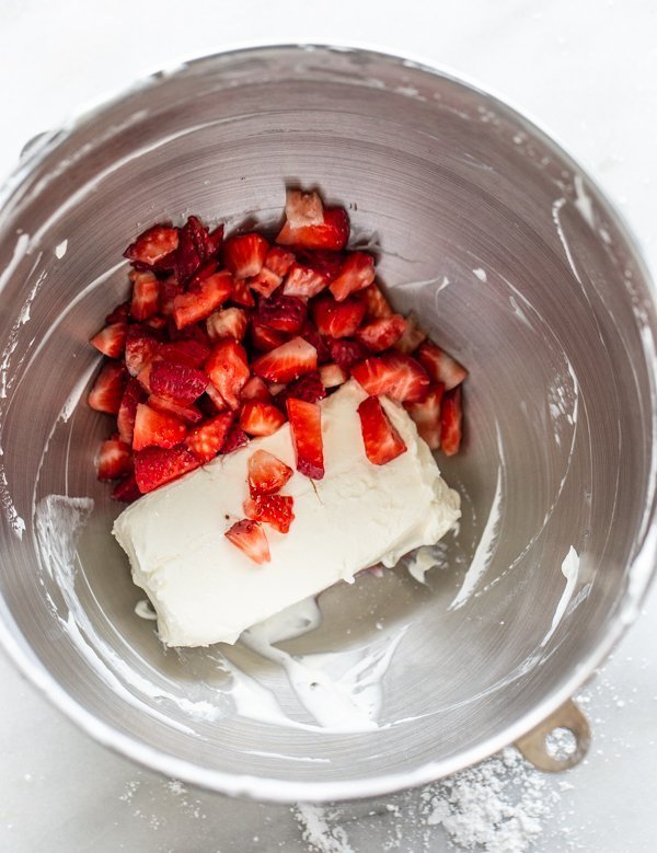 cream cheese and strawberries in a metal bowl