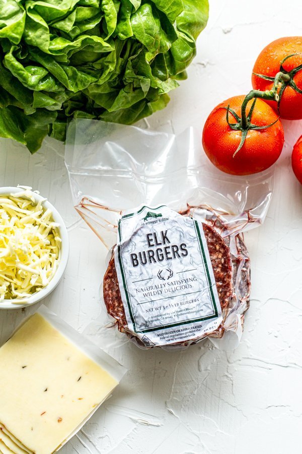 burger ingredients on a white board