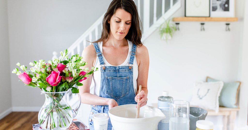 girl with brunette hair mixing up DIY face and hair masks