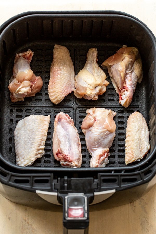 raw chicken wings in an air fryer