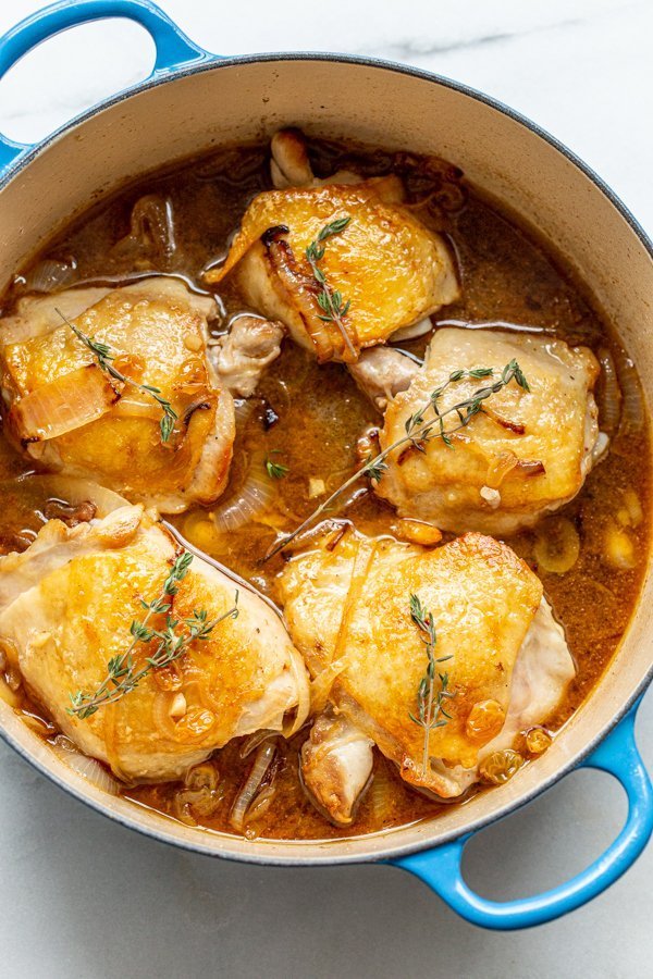 chicken thighs in a dutch oven with thyme