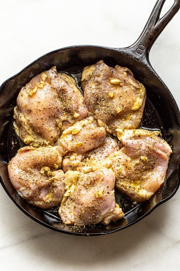 marinated chicken in a skillet