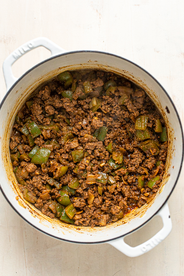 meat and peppers browned in a skillet