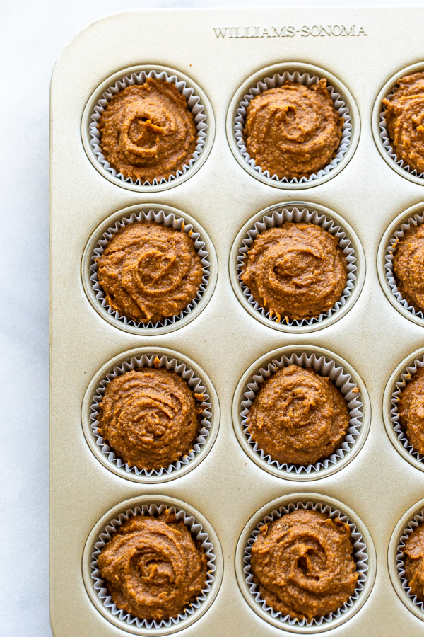 muffins with pumpkin in a gold muffin tin