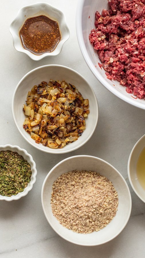 onions, deer meat, spices + herbs, egg and vinegar to make meatloaf