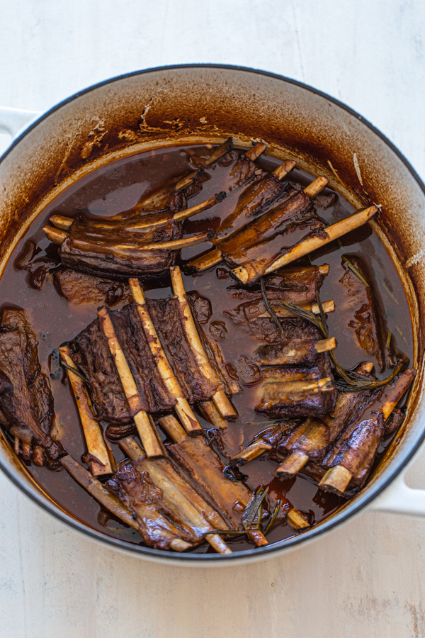 braised short ribs in liquid falling off the bone