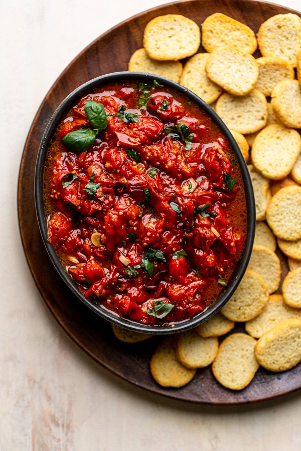 bruschetta in a bowl with crostini and basil