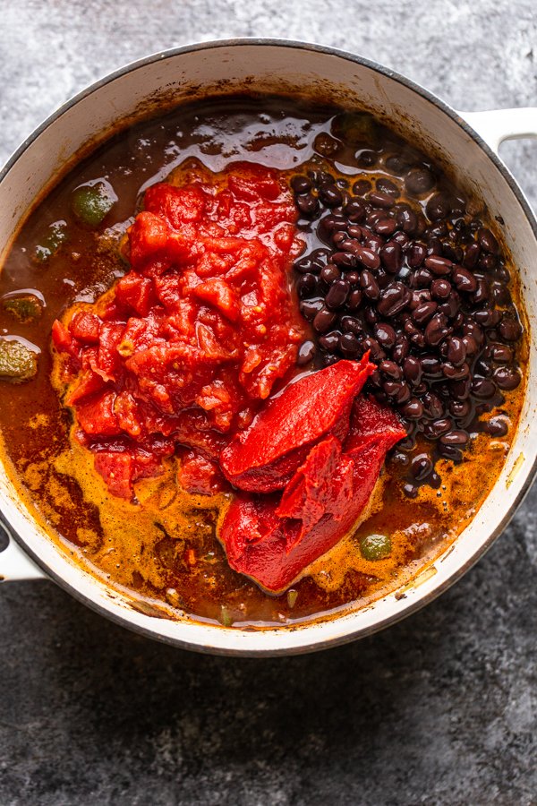 ingredients for chili in a white pot