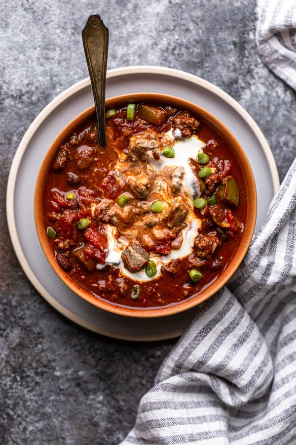 bear chili with a swirl of sour cream in a bowl