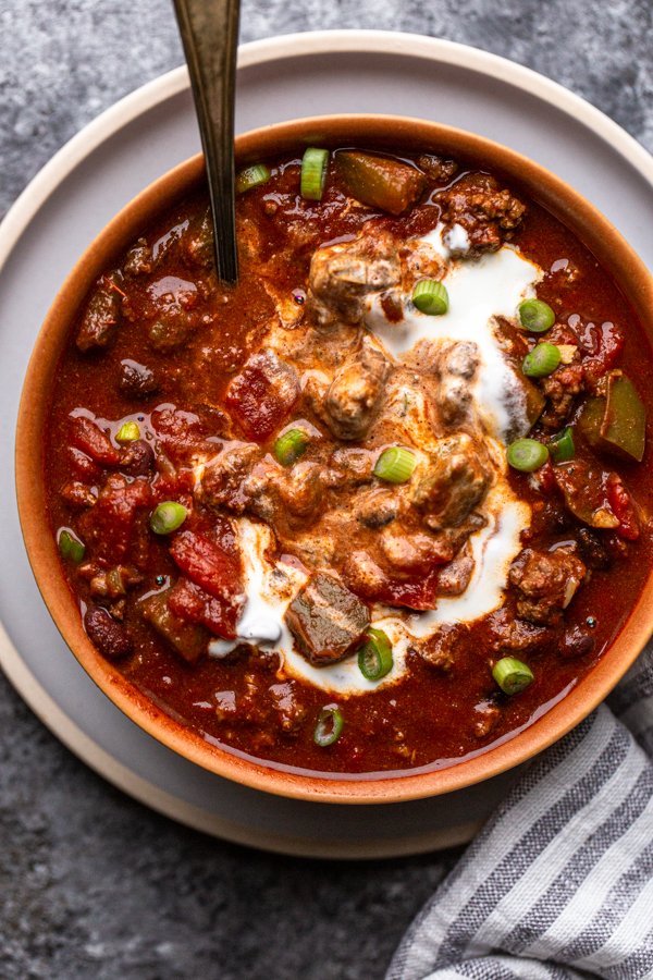 bear chili with a swirl of sour cream in a bowl
