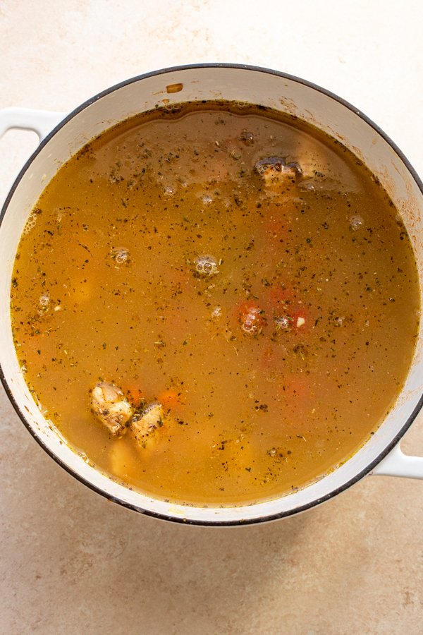 broth poured in a large white pot