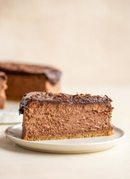 a slice of chocolate cheesecake on a white plate