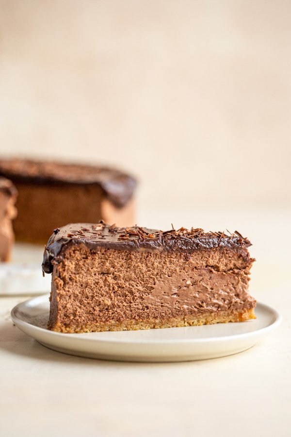 a slice of chocolate cheesecake on a white plate