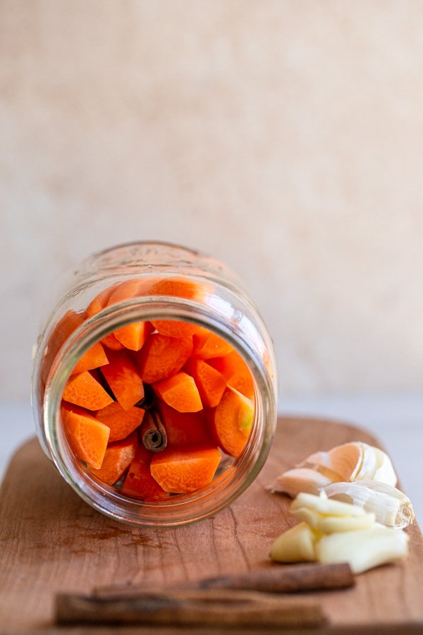 carrots in a sideways glass jar